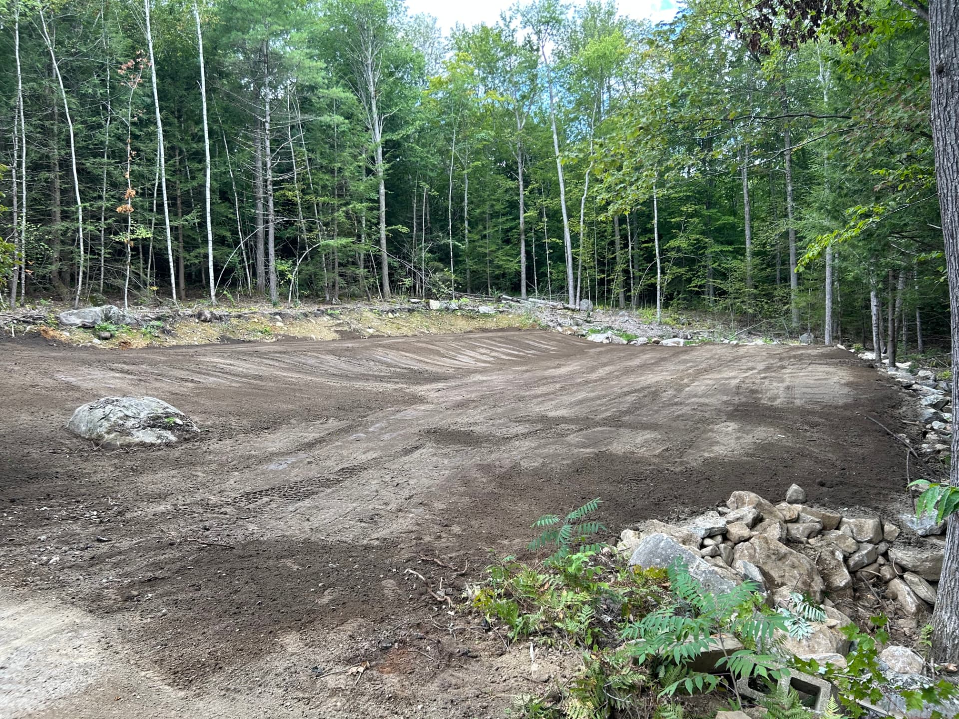 Freshly graded and finished ground after a yard expansion